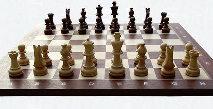 Chess board with all pieces in their starting positions.